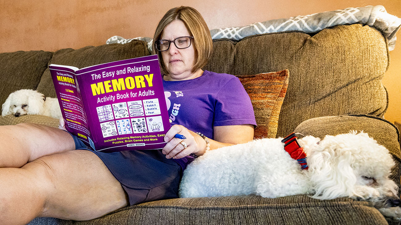 Melissa reads and completes puzzles as a means of cognitive stimulation. 