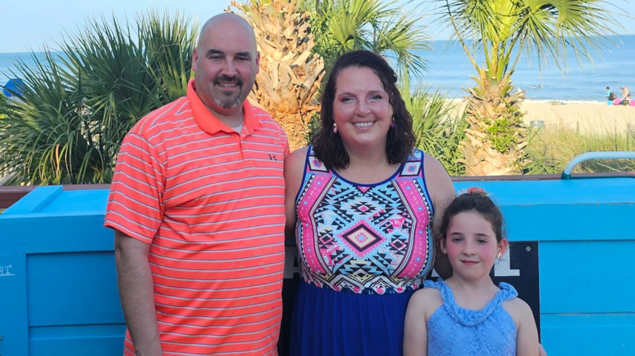 Melissa with her husband and daughter. 