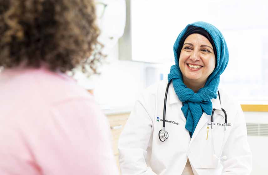Patient talking to a Cleveland Clinic caregiver.