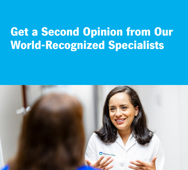 Heart doctor talking to patient in exam room.