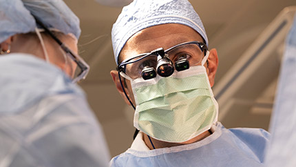 Two Cleveland Clinic doctors in surgery.